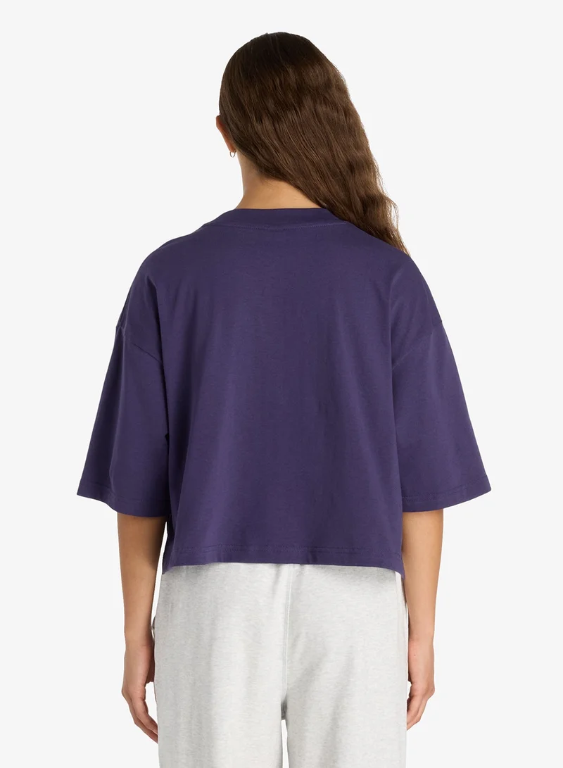 New Balance Athletics Premium Chest Logo Cropped T-Shirt